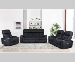 Black reclining sofa set in a living room setting with decor elements.