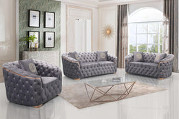 Gray tufted sofa set in a stylish living room with large windows.
