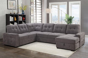 Gray sectional sofa in a living room with large windows and decor.